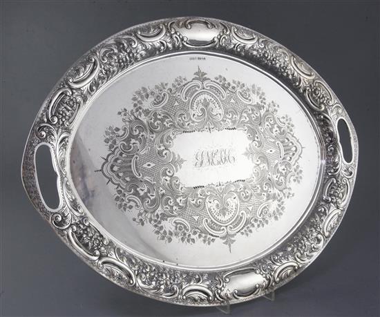An ornate late Victorian silver oval tray by John Henry Potter, 74 oz.